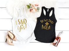 two tank tops that say i said we had nola and i said yes on them