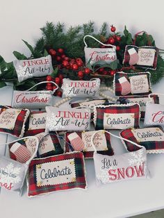 a table topped with lots of pillows and christmas decorations