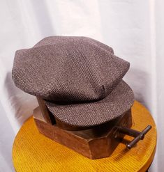 Although not vintage this beautiful Bespoke Newsboy Cap is just as vintage style you can get. Manufacturered by Simons made in U.S.A. a true treasure and I would be hard to beat, great fabic, great authentic look, real soft leather sweatband. Please view photos Condition: Custom made never worn you will not be disappointed super nice quality no defects. All questions welcomed. Buyer pays all related Priority shipping cost and insurance. All Sales Final Thank you CityVintage Vintage Cap For Fall, Vintage Flat Bill Hat For Fall, Vintage Brown Flat Cap, Vintage Fall Hats, Vintage Wool Cap, Vintage Flat Cap For Winter, Vintage Wool Flat Cap, Fitted Vintage Cap, Newsboy Cap