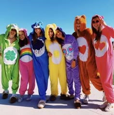 a group of people in costumes standing next to each other