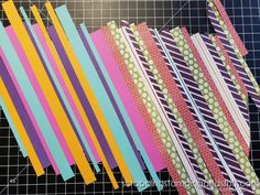 several strips of paper laid out on a cutting board