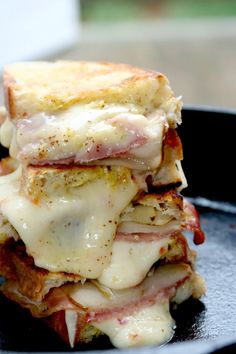 a stack of food sitting on top of a black plate