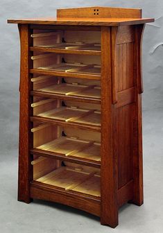 a wooden book shelf with several shelves on each side