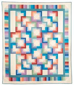 a multicolored quilt with squares on it