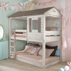 a child's bedroom with a bunk bed and pink decorations on the walls,