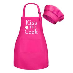 a hot pink apron with the words kiss the cook on it and a pink hat