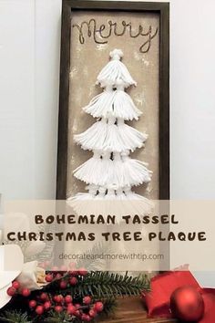 a christmas tree made out of white tassels on top of a wooden table