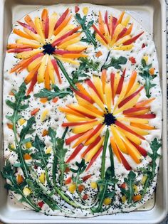 an image of food that looks like flowers in the middle of some kind of cake