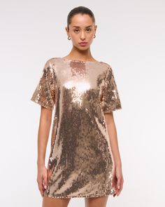 Flattering short-sleeve shift mini dress in our small stretch sequin fabric, featuring an open back with cross-back bar detail and crew neckline. Shift Mini Dress, Sequin Tee, Sequin Fabric, Mini Shift Dress, Sequin Dress, Abercrombie Fitch, Jumpsuit Dress, Crew Neckline, Open Back