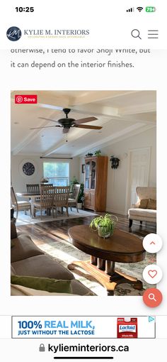 a living room filled with furniture and a ceiling fan