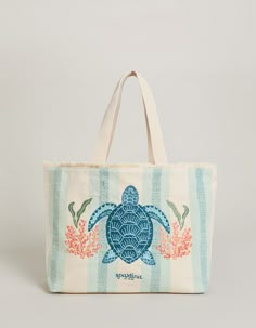 When it comes to totes, our embroidered Sea Turtle Beach Tote topped with fringe is tote-ally cute. This roomy bag with webbed woven straps holds everything - and then some! - including the quick-get items in its convenient inside pocket. Best of all, It's made from thick, durable canvas and a coated base that can stand up (literally!) to day after day of splashy fun. Embroidered sea turtle Cotton fringe top with woven cotton shoulder straps Small inside slip pocket Dimensions: 15.75'' W; 13'' H Cute Beach Bags Totes, Beach Items Aesthetic, Beachy Handmade Tote Shoulder Bag, Beachy Canvas Tote Bag For Summer, Beachy Canvas Tote Bag For Beach Season, Lowcountry Style, Ocean Tote Bag, Tote Bag Beach, Beach Items