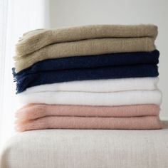 folded towels stacked on top of each other