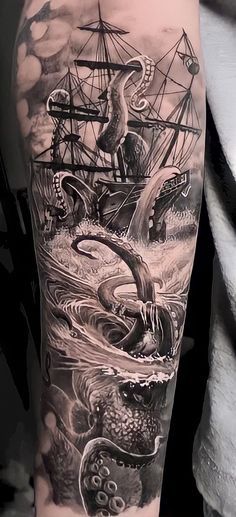 an octopus and ship tattoo on the arm