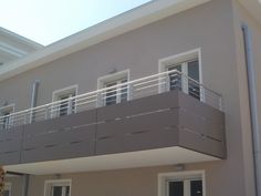 an apartment building with balcony and balconies