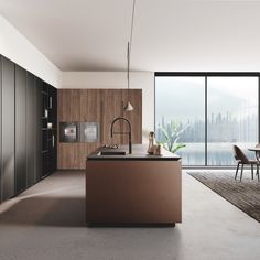 a modern kitchen with an island and dining table in front of large windows overlooking the city