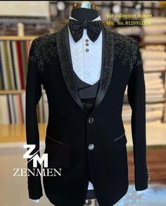 a black tuxedo with white shirt and bow tie is displayed on a mannequin