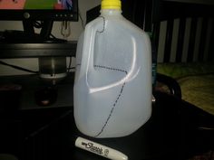 a plastic jug sitting on top of a table