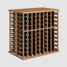 a wooden wine rack filled with lots of bottles