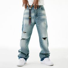 Unlock edgy and effortless style with our M ripped jeans. Made with high-quality denim, these jeans are designed to be both durable and fashionable. The distressed detailing adds a touch of edginess to your look, making them perfect for any occasion. Elevate your wardrobe with these premium jeans that exude sophistication and exclusivity. Features: -45% Cotton, 55% Polyester -Mid-Waist -Premium Denim Fabric -Regular fit -Street style Ripped Washed Blue Jeans For Fall, Blue Ripped Cotton Cargo Jeans, Ripped Blue Straight Leg Cargo Jeans, Washed Blue Jeans With Frayed Hem For Streetwear, Casual Ripped Denim Blue Cargo Jeans, Urban Distressed Medium Wash Jeans, Trendy Denim Blue Jeans For Streetwear, Edgy Relaxed Fit Jeans For Streetwear, Trendy Ripped Blue Cargo Jeans