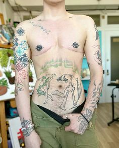 a man with many tattoos on his chest