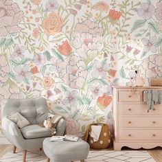 a chair and ottoman in front of a floral wallpaper with pink flowers on it