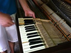 a man is playing an organ with his hands