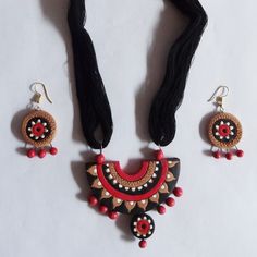 Necklace and earrings set - hand painted clay. discovered while waiting for the ferry back to Mayapur from Nabadwip West Bengal - sold in a little little booth behind the tobacco/candy booth - i understood - she had painted those one-of-a-kinds and  imagined the hut in the jungle that inspired those primitive patterns - i later discovered all the way up to delhi many same style one-of-a-kinds .... but none as pretty and fancifull Artistic Hand Painted Jewelry For Festive Occasions, Red Hand Painted Jewelry For Festivals, Hand Painted Multicolor Clay Jewelry, Handmade Red Clay Jewelry, Bengal Jewellery, Candy Booth, Antique Elephant, Painted Necklace, Jewelry Sets Handmade