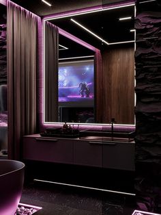 a bathroom with a large mirror, tub and purple lighting in it's corner