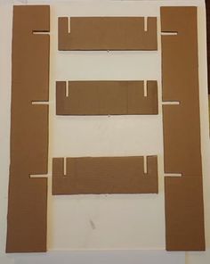 some brown cardboard pieces sitting on top of a table