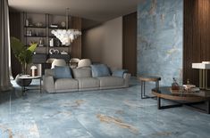 a living room with blue marble floors and walls