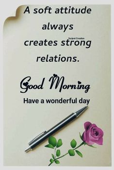 a note with a pen sitting on top of it next to a flower and the words good morning have a wonderful day