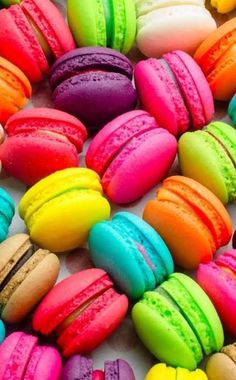 many colorful macaroons are arranged together