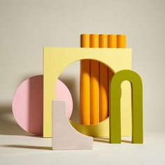 an assortment of colorful objects sitting on top of a white table next to each other