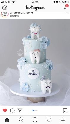 a three tiered cake decorated with toothbrushes and flowers