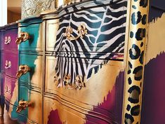 an ornate dresser painted with different colors and patterns