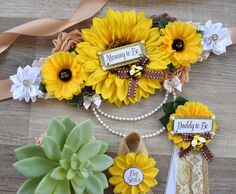 sunflowers, pearls and ribbons are arranged on the floor for a memorial display