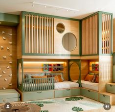 a child's bedroom with bunk beds and green accents on the walls is shown