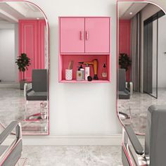 a room with two mirrors and pink furniture in it, all on the same wall