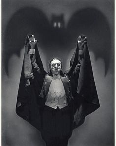 an old photo of a man with wings in the air