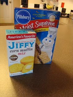 two boxes of cereal sitting on top of a counter