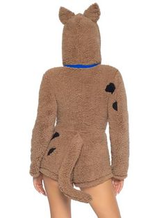 a woman in a teddy bear costume is standing with her back turned to the camera