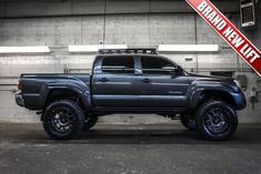 a large gray truck parked in a garage