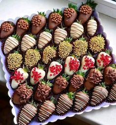 a platter filled with chocolate covered strawberries