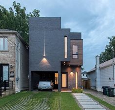 a house with a car parked in the driveway