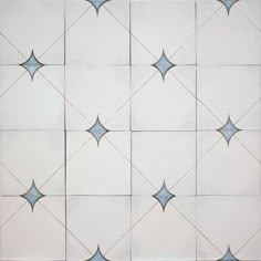 a white and blue tiled wall with stars on it