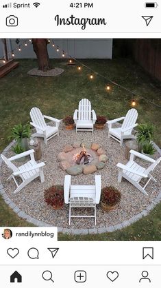 an image of a fire pit in the middle of a yard with chairs around it