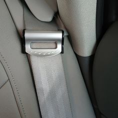 the seat belt is attached to the back of a car