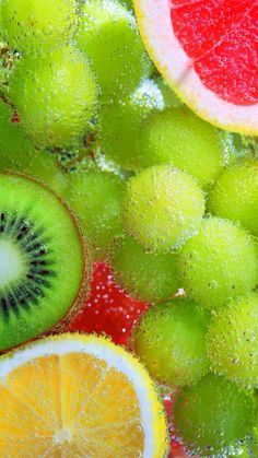 the fruit is cut in half and ready to be mixed with other fruits, including kiwis