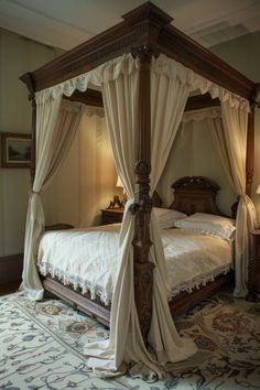 a four poster bed with curtains on the sides