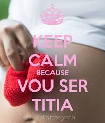 a pregnant belly with a red knitted mitt on it and the words keep calm because you see tita